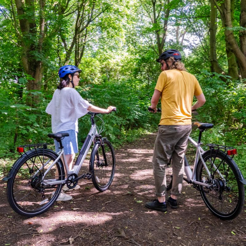Falcon Horizon Low Step e-bike lifestyle Two people in a forest setting