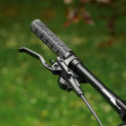 Roxform Gravion crossroad eMTB brake lever Close-up against a blurred green background