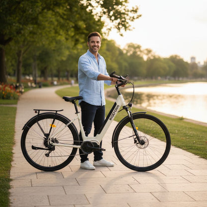 Roxform_Stride_L_e-bike lifestyle Man standing on a path with trees and water in the background