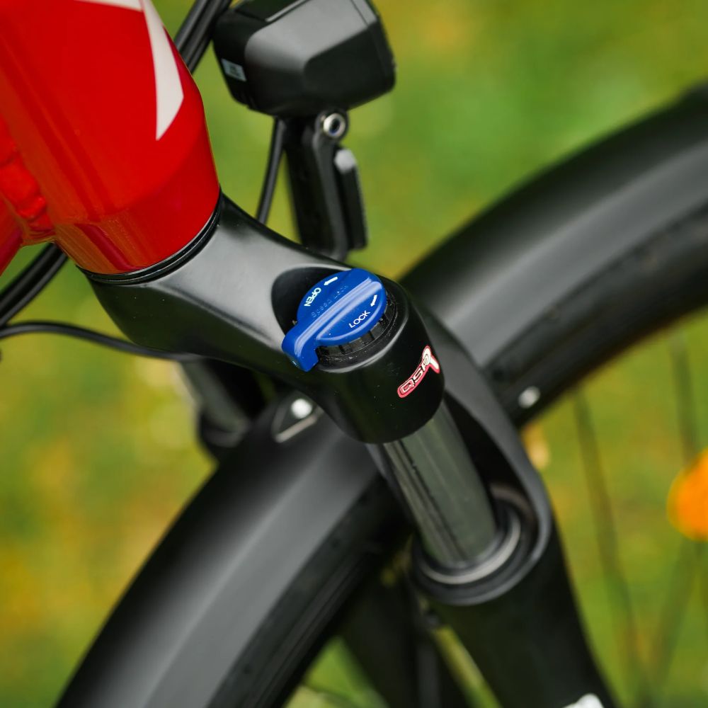 Roxform_Stride_S_e-bike_suspension fork lock with a blurred natural background.