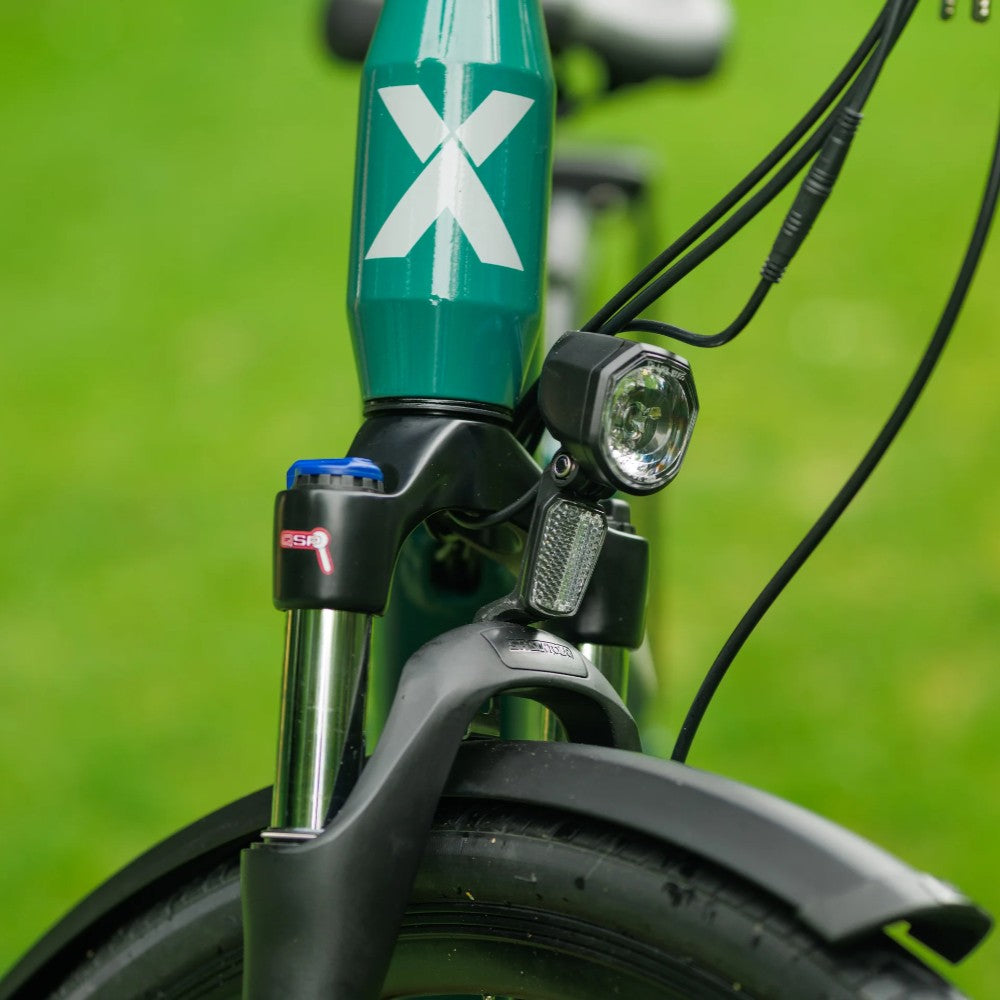 Roxform Valor S e-bike front light Close-up on a blurred green background