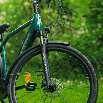 Roxform Valor S e-bike front suspension fork on a blurred green background