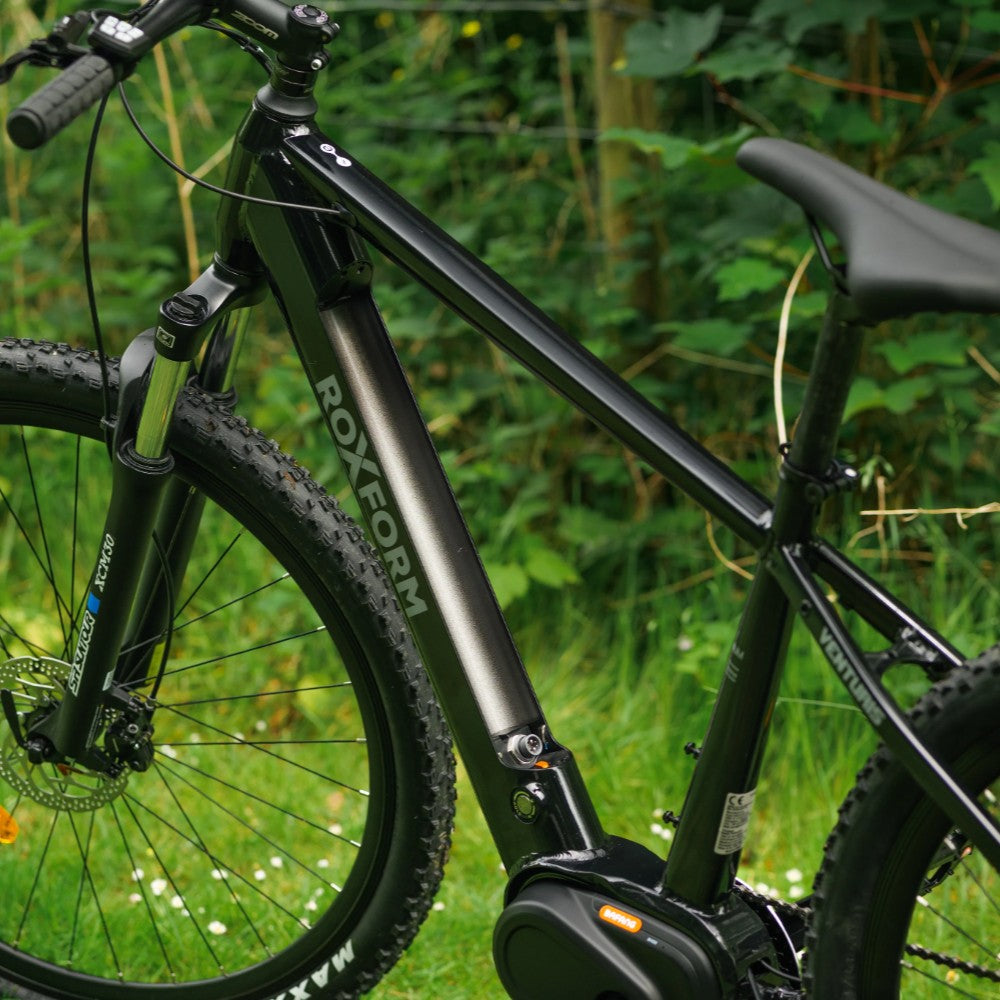 Roxform Venturis eMTB battery slot on a green outdoor background