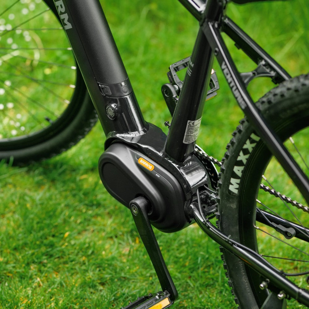 Roxform Venturis eMTB mid motor Close-up on a grassy background.